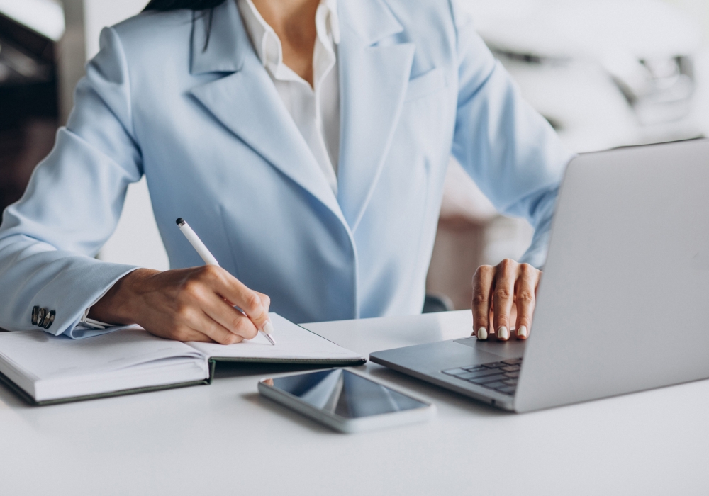 Business woman working in office on computer